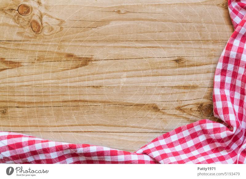Red and white checkered kitchen towel on a light wooden background Checkered Bright Wood Kitchen sign Rustic Beer garden tablecloth Napkin Gastronomy