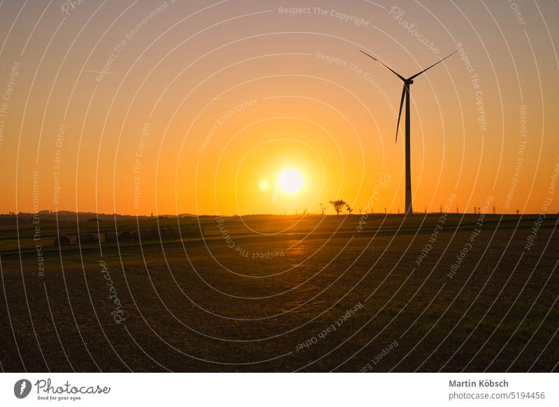 onshore wind turbine on a meadow at sunset. Renewable energy. Clean electricity wind power plant clean energy second change grid supplier power generation