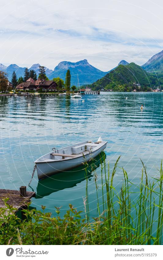 Wooden boat on the lake of Annecy France alps annecy europe french landscape mountains nature outdoor panorama sailing scenic talloires tourism travel vacation