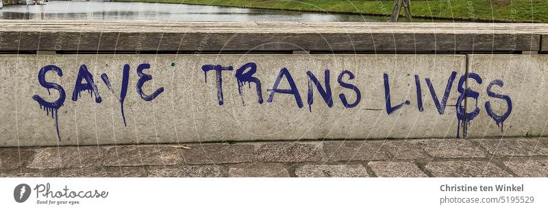"SAVE TRANS LIVES" is written on the wall Save trans lives writing Graffiti Wall (barrier) statement Text Characters transsexuality Sexuality Gender identity