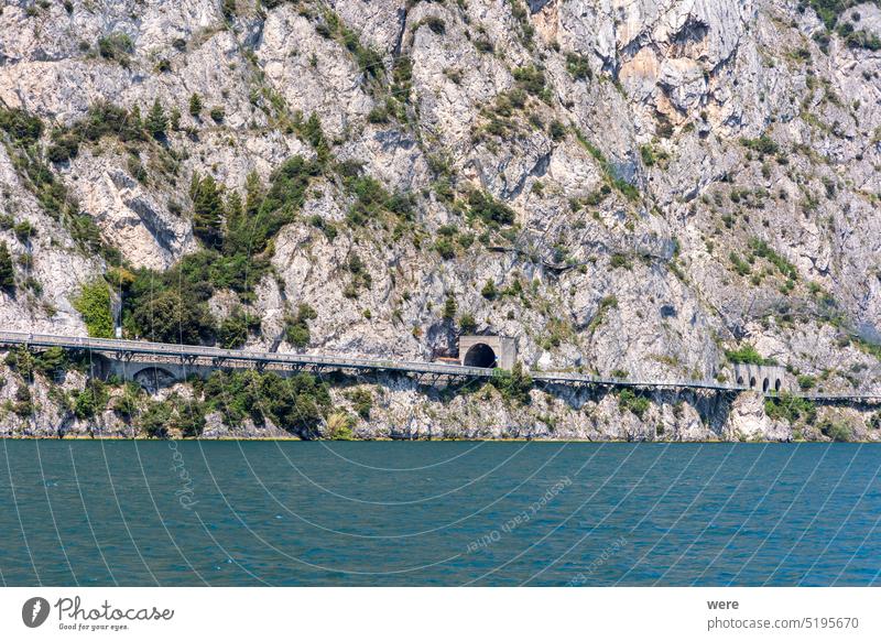View from Lake Garda in Italy of the course of the Gardesana Occidentale road through the rock face on the western shore of the lake Course H2O Liquid