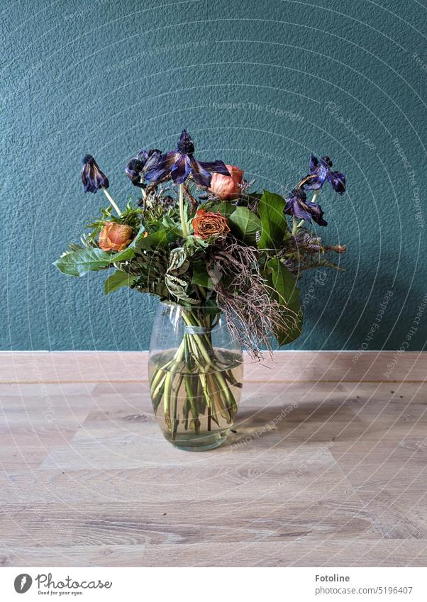 A vase with dried flowers stands on the floor in front of a petrol-colored wall. Looks like a still life, doesn't it? Still Life Colour photo Interior shot