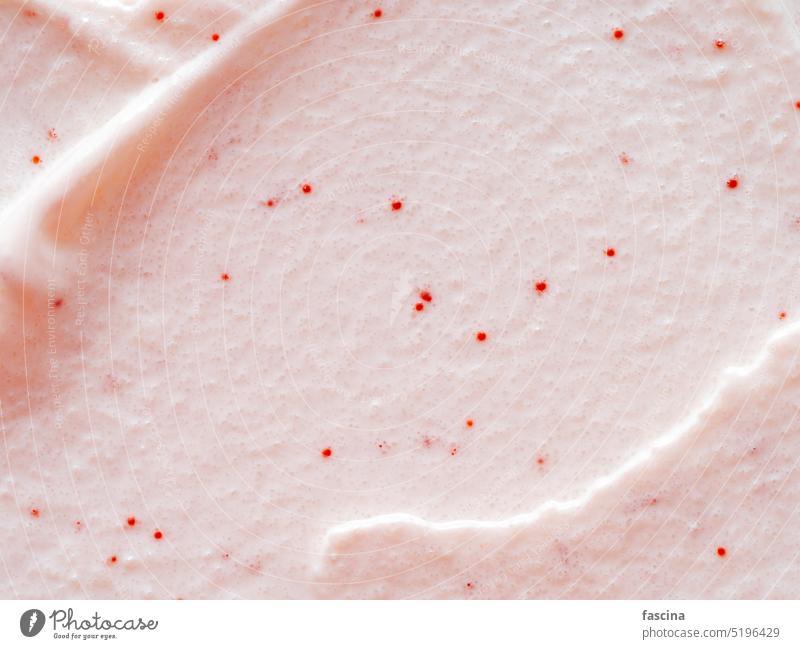 Scrub smears. Pink exfoliating body polish texture scrub exfoliation gommage cosmetic face crushed pastel pink background copy space top view flat lay overhead
