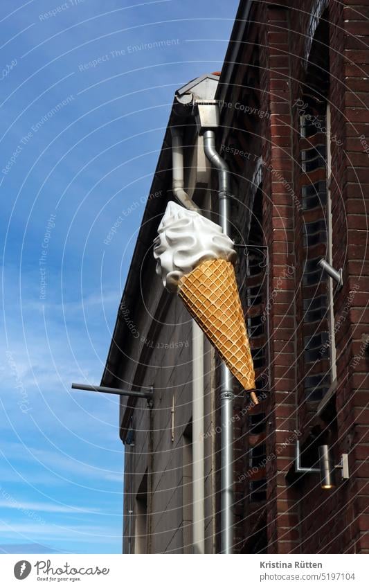 a big vanilla soft ice cream hangs at the top of the house Soft ice cream Ice ice-cream cone croissant Waffle Ice-cream parlor ice cream parlour Billboard