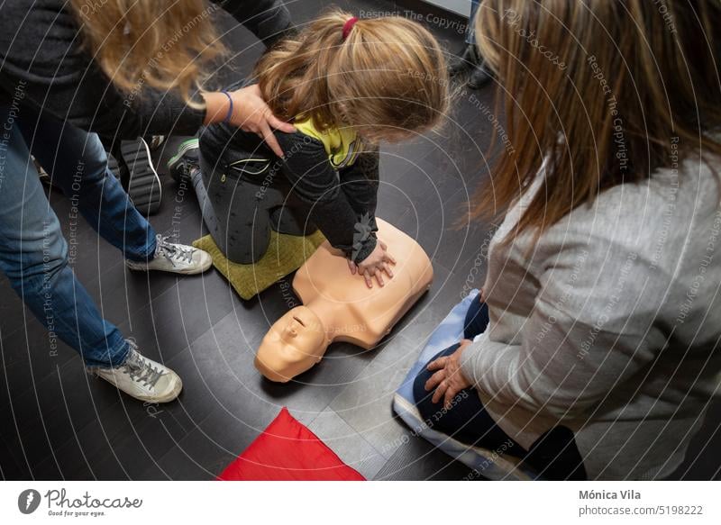 three people practice first aid and cpr resuscitation with a cpr resuscitation manikin dummy course cpr dummy medical procedures medicine disease health