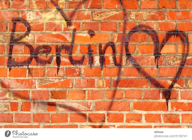 red brick wall with a big and a small sprayed heart and the lettering Berlin Wall tile Heart bricks Display of affection Graffiti Red Infatuation Emotions Daub