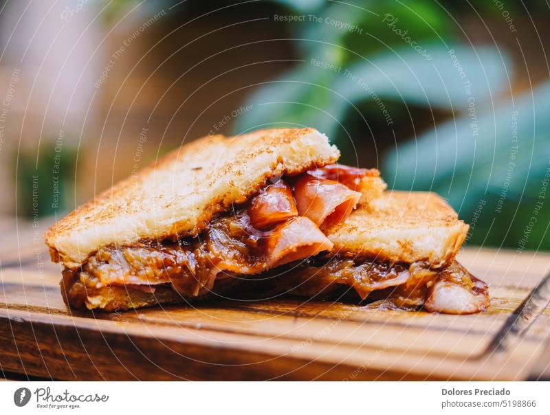 Breakfast sandwich with bacon, cheese and tomato sauce on wooden board american appetizer background bread breakfast cheddar cherry closeup club cooking cuisine