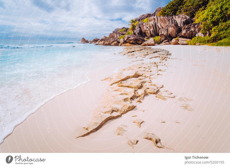 Amazing Granite rocks, white sand and blue clear ocean at Grand Anse, La Digue island, Seychelles. Nature background anse digue grande granite beach sea coast