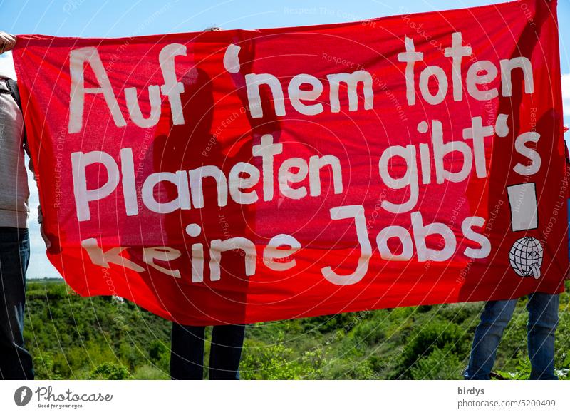Climate change. Protest against climate-damaging CO2 emissions. protest banner Red rag Text Climate protection activists Counterargument Survive System change