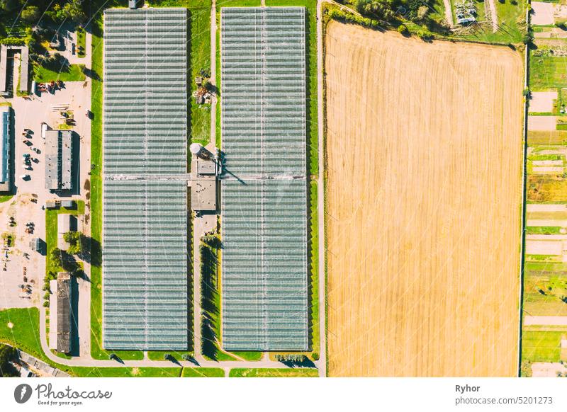 Aerial View Greenhouses For Growing Flowers, Vegetables And Fruits. Agricultural And Industrial Buildings industry aerial agriculture area bird eye