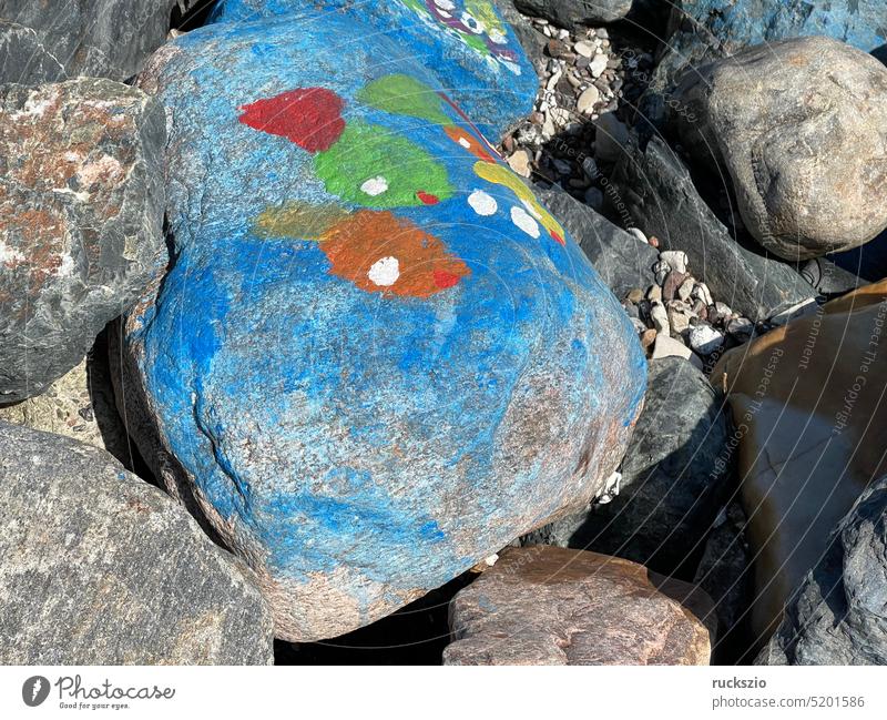Colorful stones on the beach colorful rock Boulders Adorned Jewellery variegated Colour Design Art Funny out attractive Extravagant spotted Speckled Yellow Blue