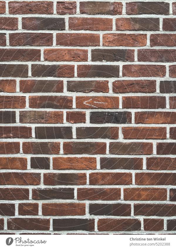 An old brick wall with a small painted arrow pointing to the left Brick facade Brick wall arrow icon Wall (building) Wall (barrier) Facade Old Bricks Red Stone