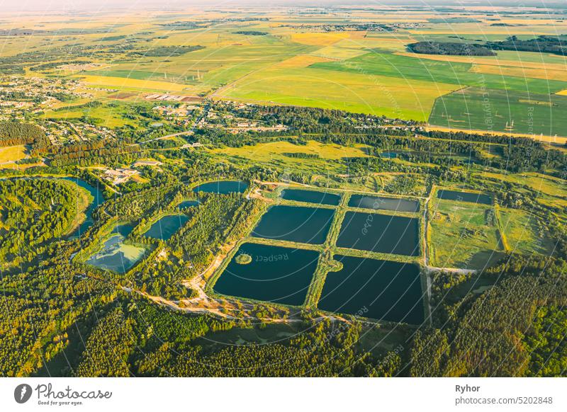 Aerial View Retention Basins, Wet Pond, Wet Detention Basin Or Stormwater Management Pond, Is An Artificial Pond With Vegetation Around The Perimeter, And Includes A Permanent Pool Of Water In Its Design