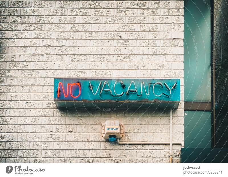 No Vacancy with neon light Word English Neon light Characters Typography Capital letter Signs and labeling mobile phone photo No free rooms Signage