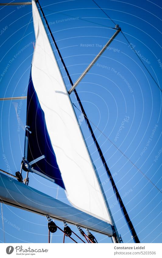 Fluttering boat sail against blue sky. Sailing Sailboat Ocean Vacation & Travel Freedom Sailing ship Sailing vacation sailboats Sailing trip Navigation windy
