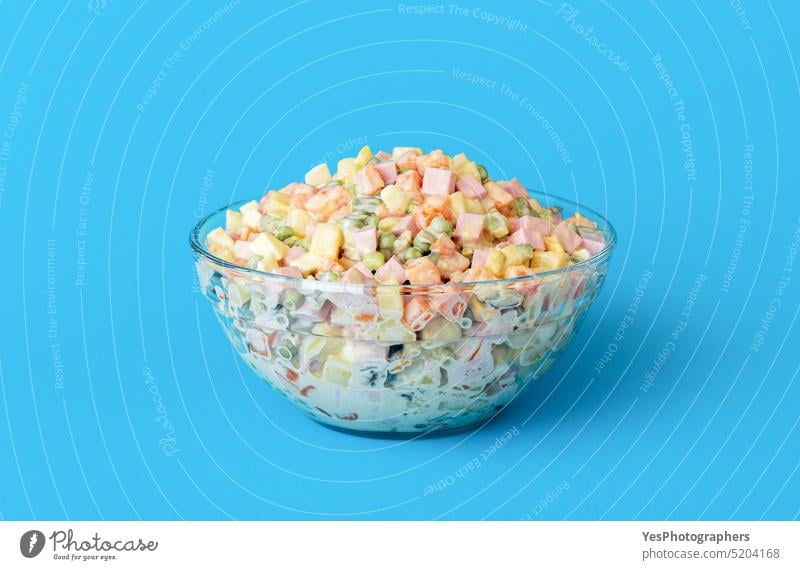 Mayonnaise salad bowl isolated on a blue background baked baloney bright carrot chopped christmas close-up cold color colorful cooked copy space cuisine