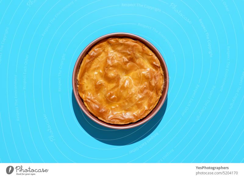 Phyllo cake above view, minimalist on a blue background baked balkan banitsa bosnian bright bulgarian cheese color cuisine culture delicious dinner dough