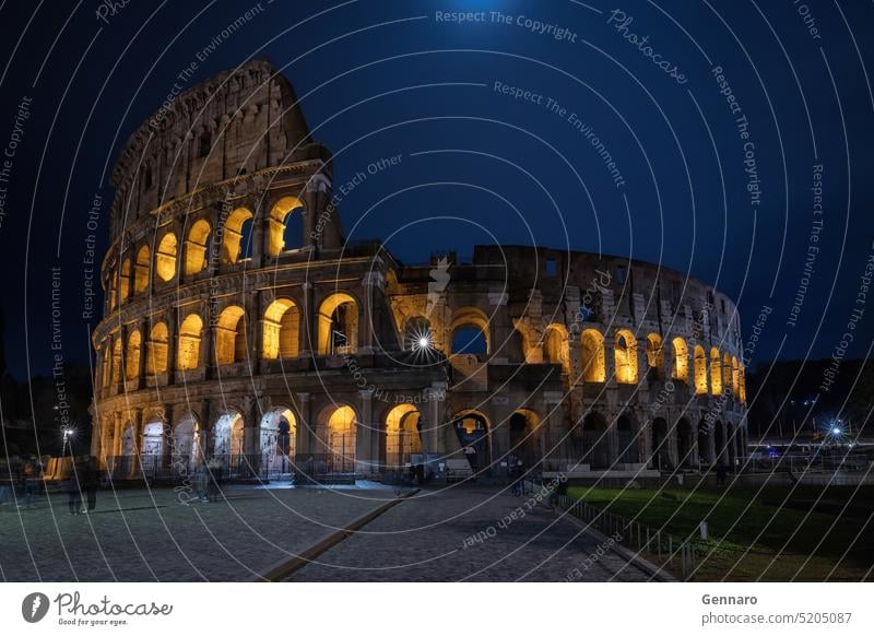 Illuminated Colosseum at night, long exposure. culture gladiator ruin travel stone tourism history coliseum old europe italian amphitheater ancient ancient rome