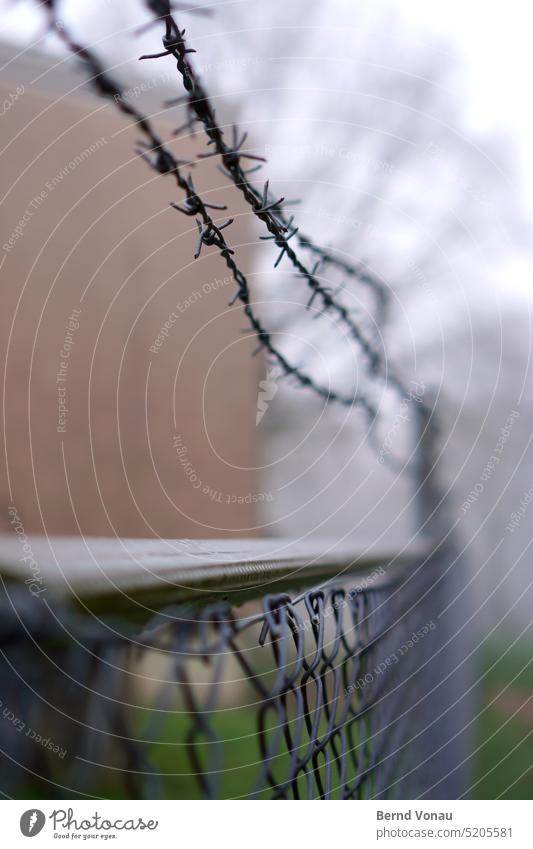 Barbed wire with fence in fog Fog Wire netting fence Captured Autumn Weather Wet Dreary depressive blurriness Green Gray Metal Protection Safety neighbourhood