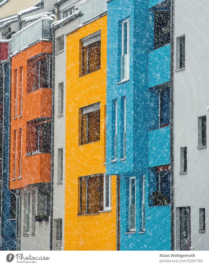 Colorful facade of residential buildings in the snow flurry. Facade Architecture Apartment Building Window House (Residential Structure) Town dwell