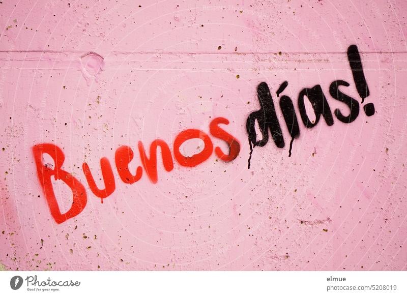 Buenos dias! is written in red and black letters on an old pink concrete wall buenos dias Good day! Good morning Spanish Concrete wall Welcome