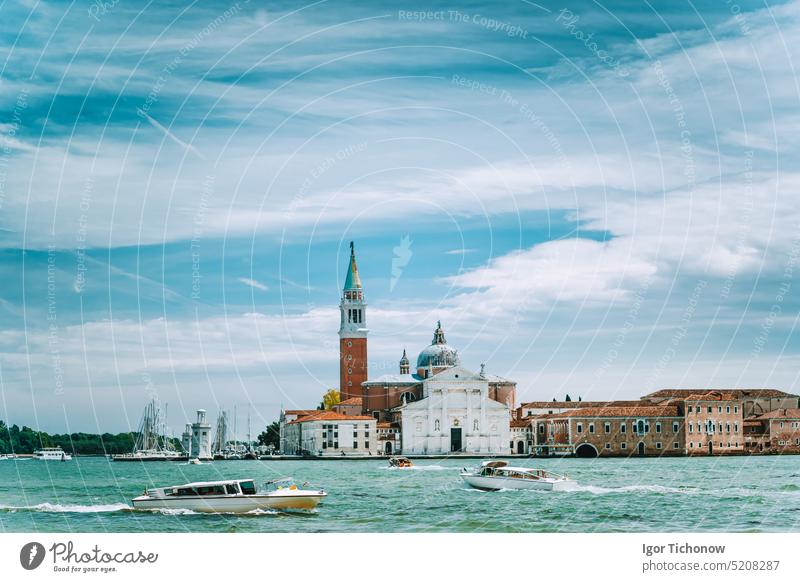 Venice, Italy. Chiesa di San Giorgio Maggiore or San Giorgio Maggiore island against blue sky and white clouds. tower church italy venice europe lagoon veneto