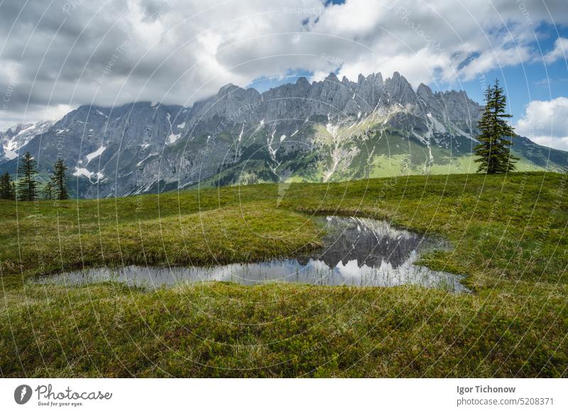 Mountain pond with Wilder Kaiser range reflecting in water, Tirol - Austria tirol austria kaiser wilder mountains trail landscape ellmau europe sky summer alps