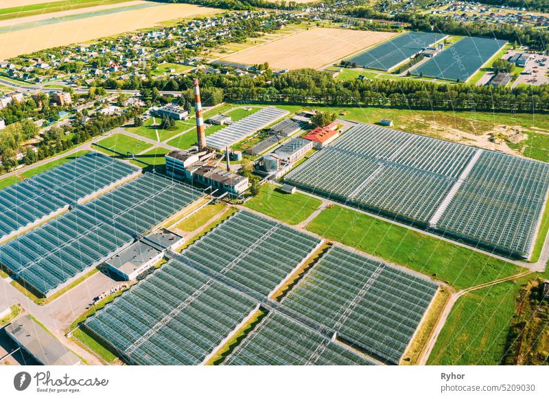 Aerial View Greenhouses For Growing Flowers, Vegetables And Fruits. Agricultural And Industrial Buildings aerial agriculture area bird eye climate condition