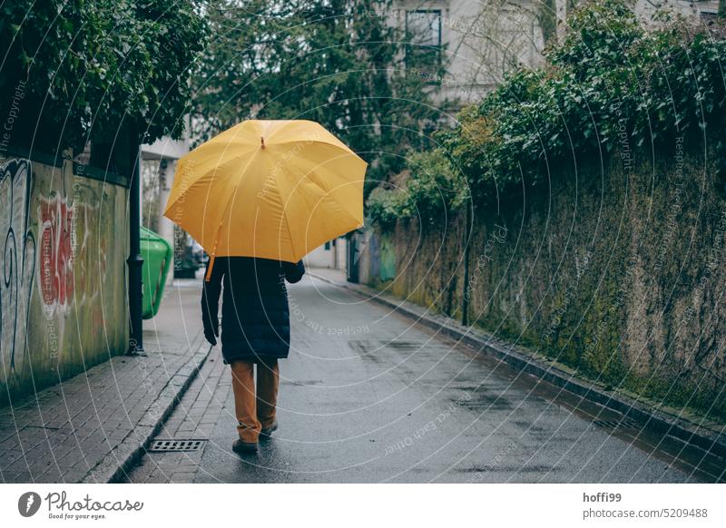 Man with big yellow umbrella walking down the street Umbrella Yellow Rain Wet Bad weather Weather Protection Human being Umbrellas & Shades Subdued colour Cold