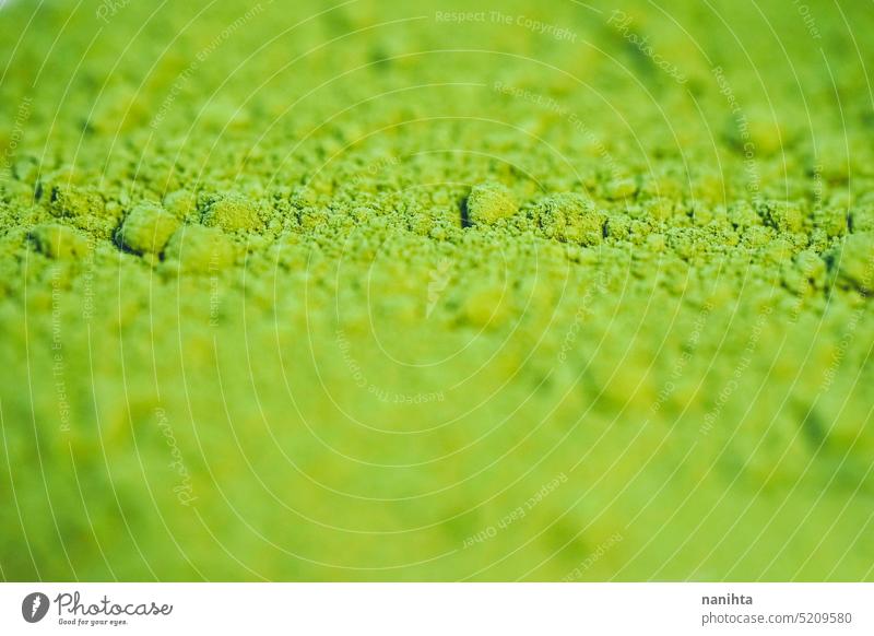 Close up of green matcha tea powder background texture macro dust close close up textured surface pure green tea organic bio colorful vibrant abstract blur