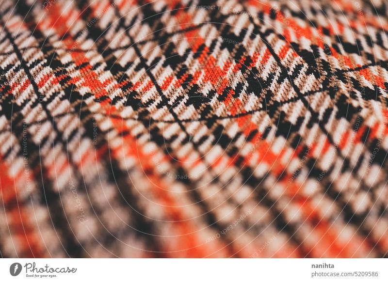Detail of plaid retro fabric for clothing vintage texture background detail old old fashioned trendy clothes warm winter autumn colors red black classic macro