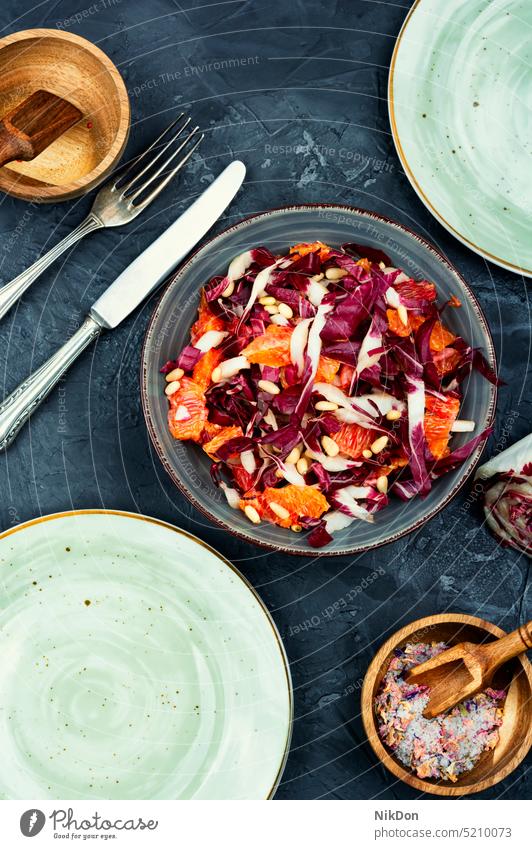 Vegetable salad with chicory on a plate radicchio vegan healthy fresh food vegetarian leaf diet chicory salad vegetable grapefruit lettuce red bowl raw
