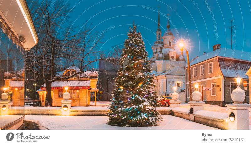 Parnu, Estonia. Christmas Tree In Holiday New Year Festive Illumination And St. Katherine Orthodox Church On Background europe estonia travel baltic landmark
