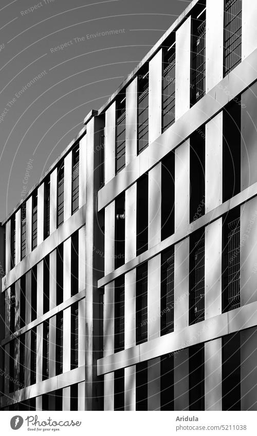 Parking garage facade graphically Architecture shape straight lines Facade Town cityscape urban car Structures and shapes b/w Building