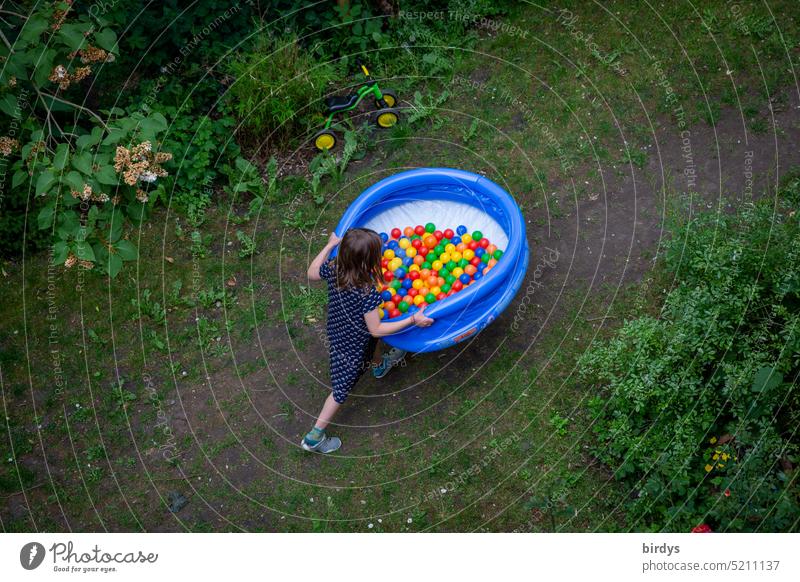 Child carries ball bath through the garden Girl Carrying Garden Infancy colorful balls Playing Toys Inflatable Paddling pool Summer Multicoloured