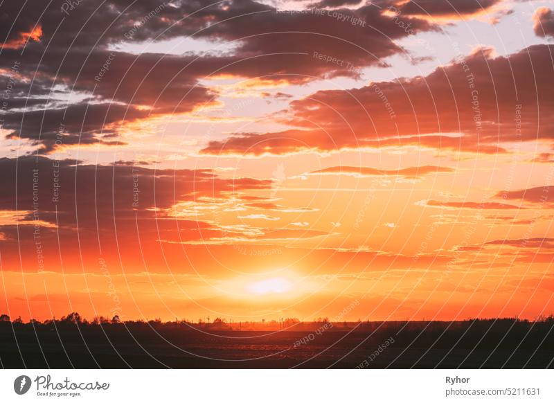 Sun Shine During Sunset Above Empty Spring Countryside Rural Soil Landscape. Field Under Sunny Spring Sky. Agricultural Landscape With Copy Space agriculture