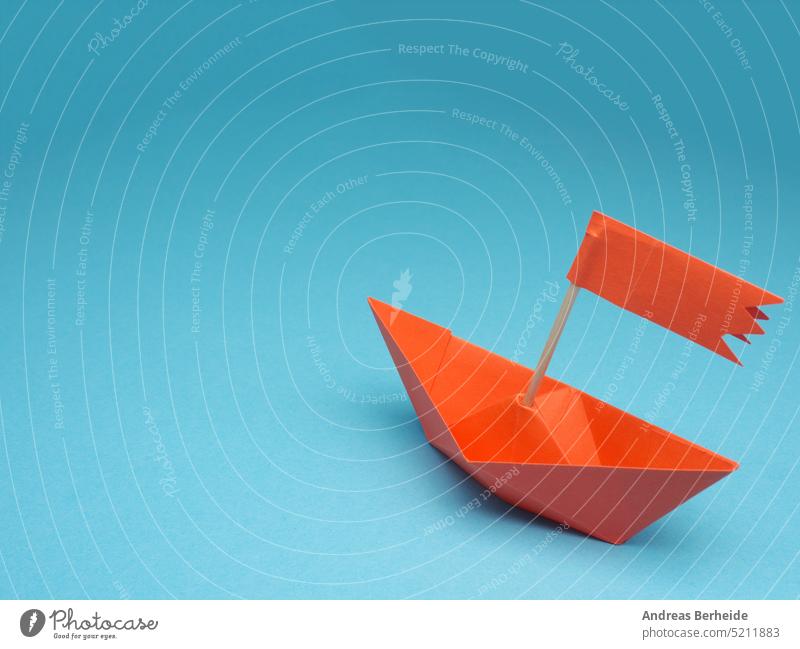 New ideas or transformation concept with a paper boat on a blue backgrond background orange ship business color competition copy space creative creativity