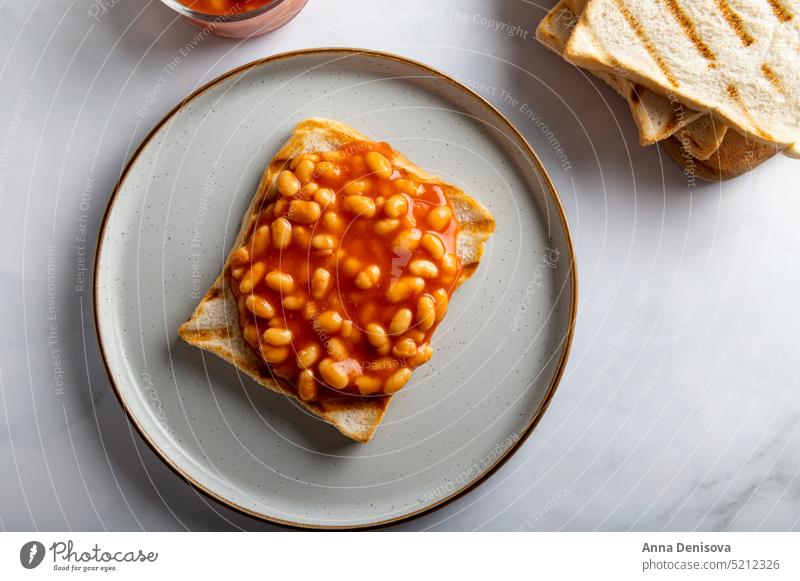 Baked Beans on Toast beans on toast bread tomato sauce slice british toasted tasty breakfast eating healthy plate vegetarian snack white baked food meal
