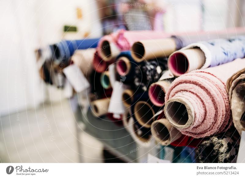 Rolls of fabrics in dressmaker's Atelier. Small business. fabrics shop. nobody small business atelier tailor shop industry equipment factory thread textile