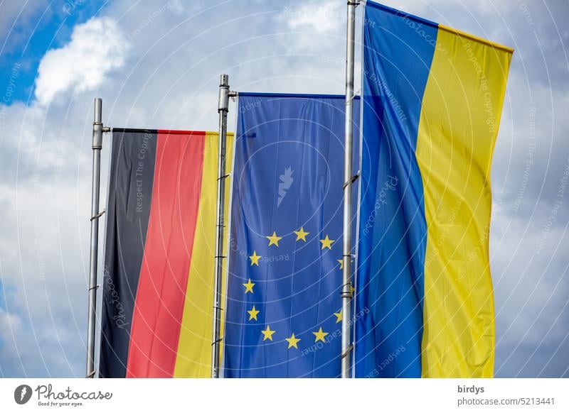 Germany flag , EU flag and Ukraine flag flying side by side in the wind Ukraine war German flag European flag Side by side European Union Attachment Solidarity