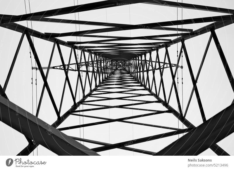 high voltage pylon from below. Black and white abstract abstract background architecture art artist cable cold spell construction electric electrical