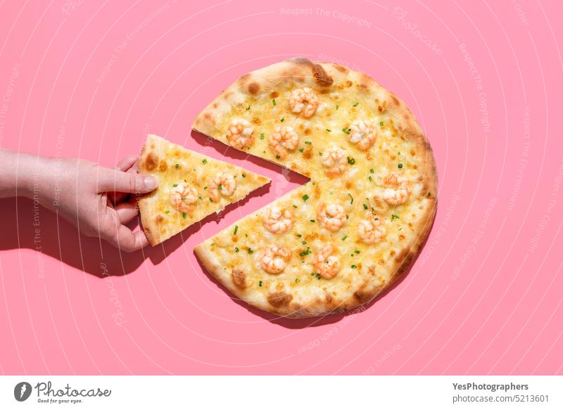 Shrimp pizza isolated on a pink background. Woman taking a slice of pizza above baked cheese color copy space crust cuisine delicious design diet dinner dish