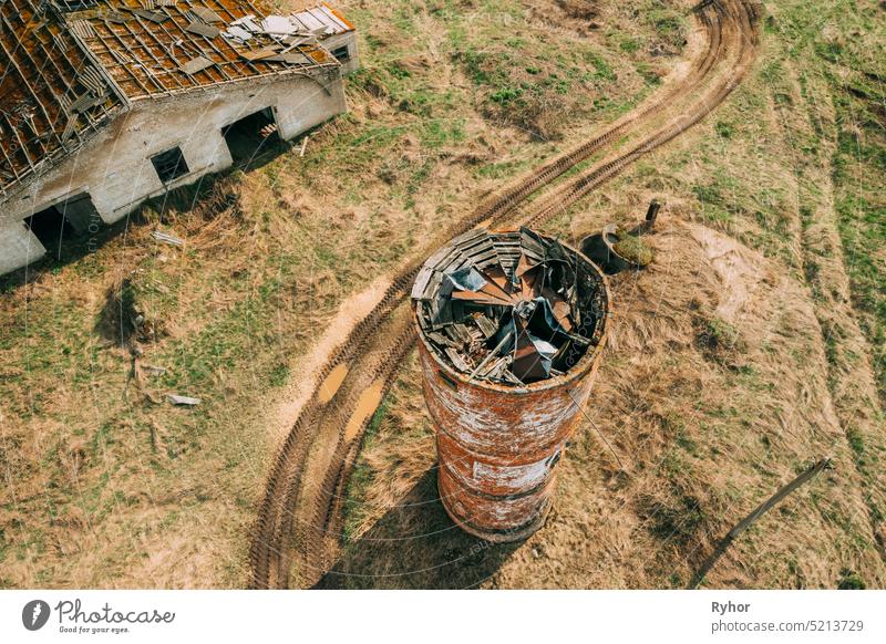 Belarus. Aerial View Of Abandoned Ruined Water Tower Near Farm In Chernobyl Zone. Chornobyl Catastrophe Disasters. Dilapidated House In Belarusian Village. Whole Villages Must Be Disposed. Chernobyl Resettlement Zone