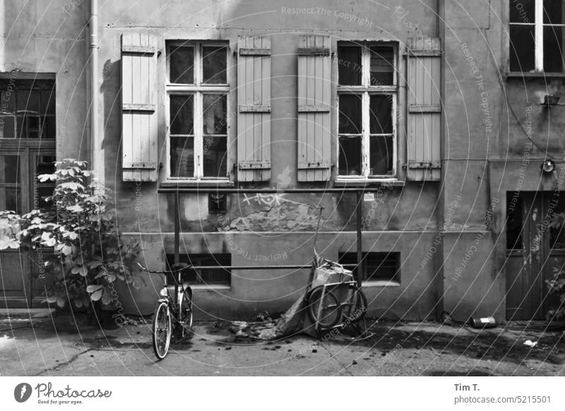 Backyard windows Berlin Prenzlauer Berg b/w Window unrefurbished bnw knock bar Black & white photo Town Downtown Capital city Day Old town Deserted Architecture