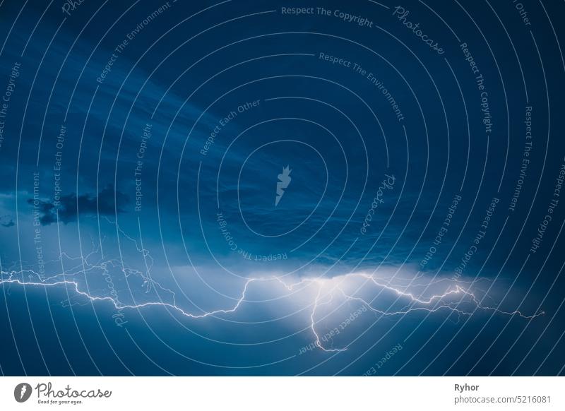 Bright Lightning On Blue Night Sky During Hunderstorm autumn background beautiful blue bright cloud cloudy copy space danger dark dramatic sky electric