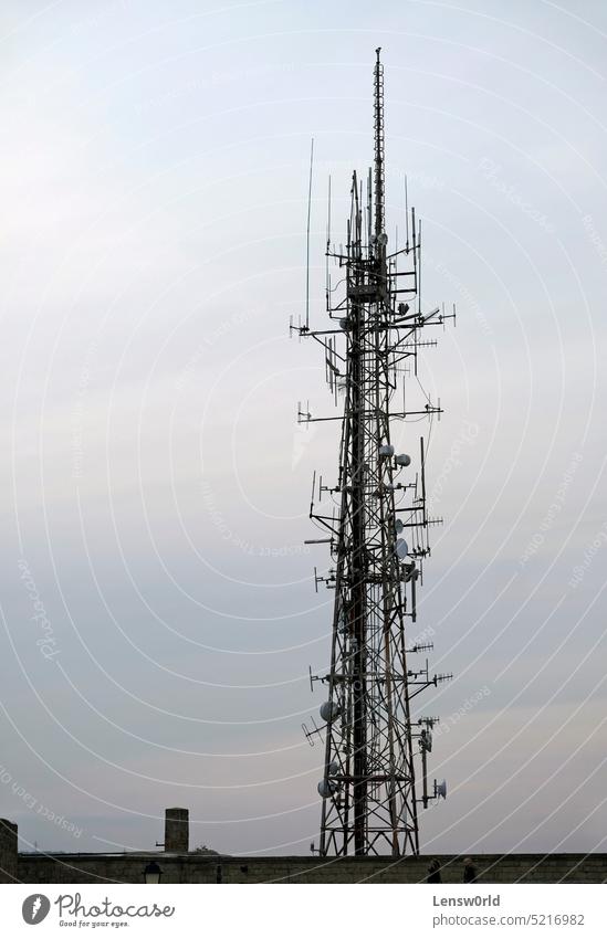 Telecommunication antenna against the evening sky blue broadcast broadcasting cell cellular equipment frequency industry metal mobile network phone radio