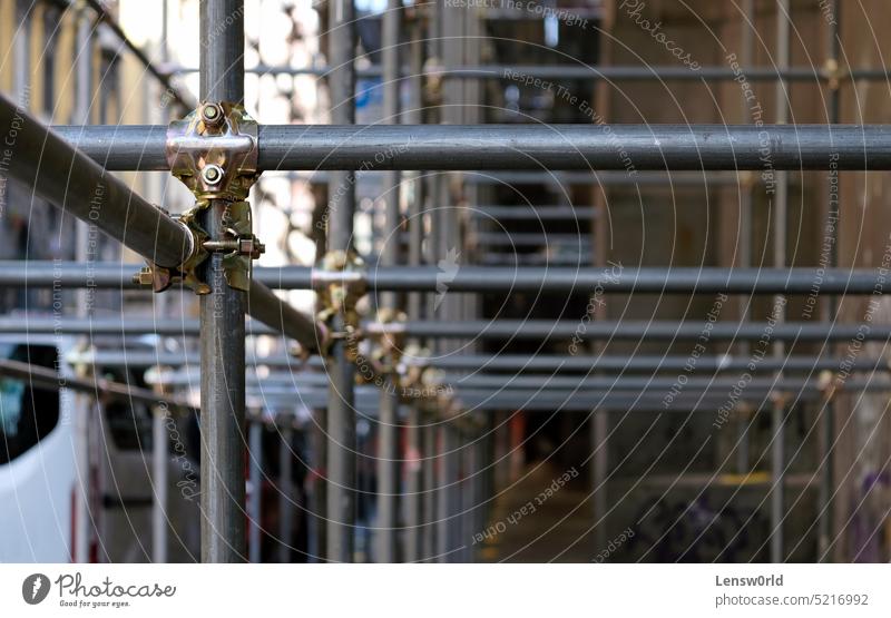 Construction to hold the scaffolding on a building in Naples, Italy background construction engineering factory focus on foreground industrial industry metal