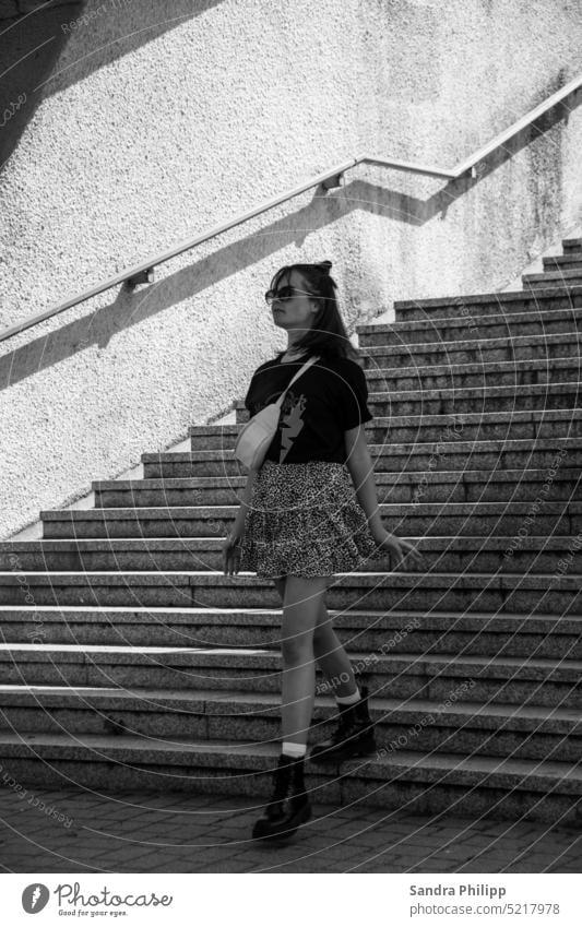 Young woman walking down a staircase Stairs black and white Cool Boots Skirt Legs Sunglasses Human being Feminine Exterior shot Adults Fashion Clothing Dress
