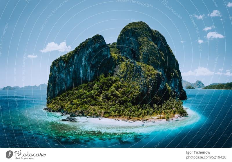 Impressive aerial drone panoramic picture of tropical Pinagbuyutan Island, small cute ipil beach surrounded by azure blue ocean. El Nido, Palawan, Philippines
