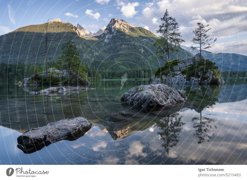 Hintersee Lake with reflection of Watzmann mountain peaks. Ramsau Berchtesgaden Bavaria, Germany, Europe panorama clouds water reflection alps scenic evening